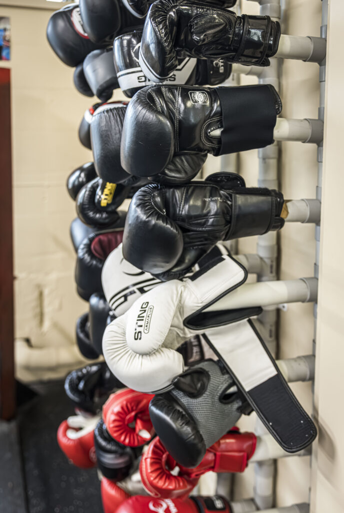 Boxing gloves hanging up in the gym
