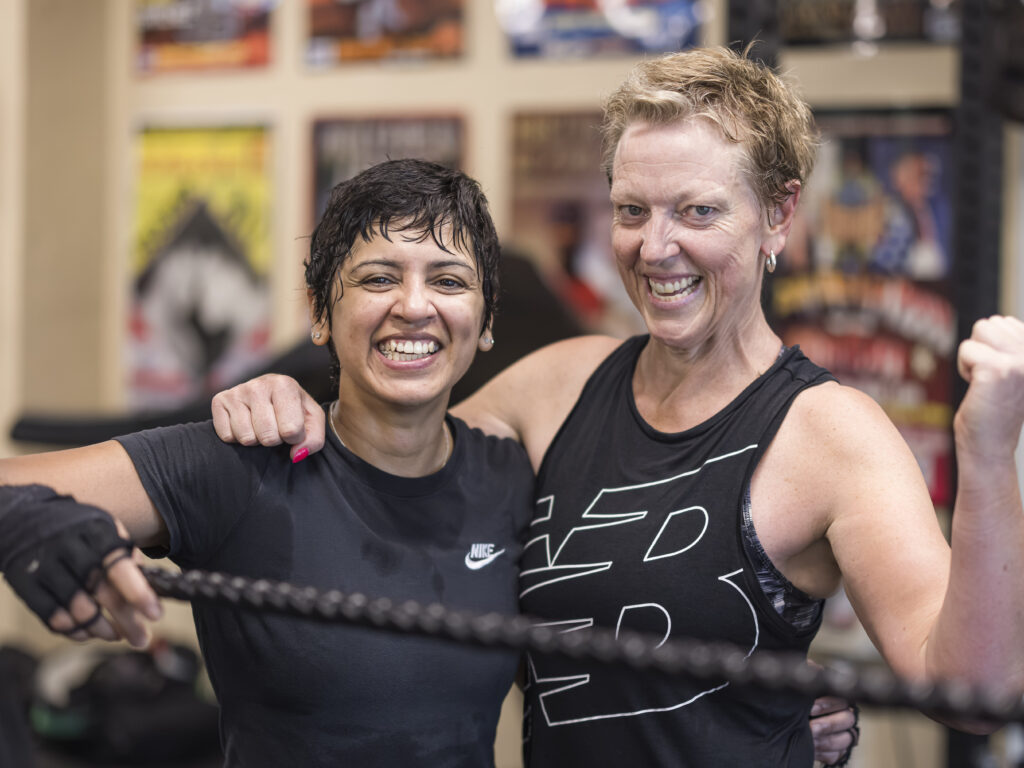 Two smiling members after class.