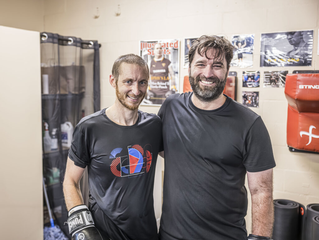 Two members smiling after class