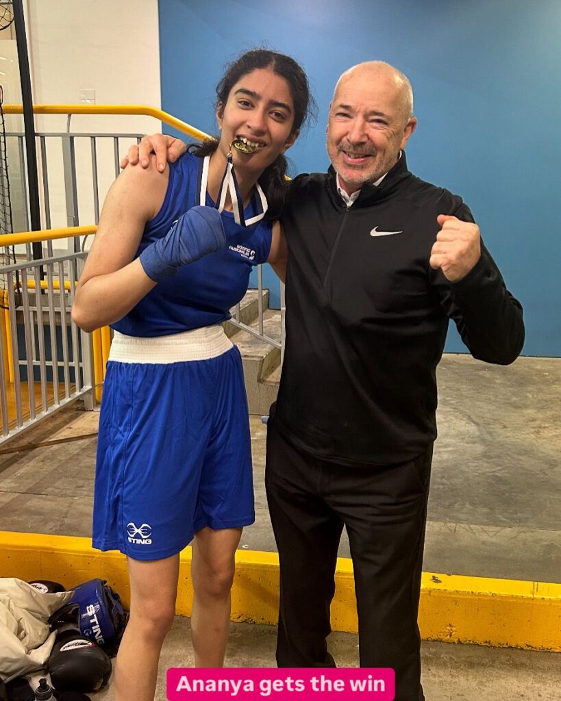 Champions - Ananya bites her medal