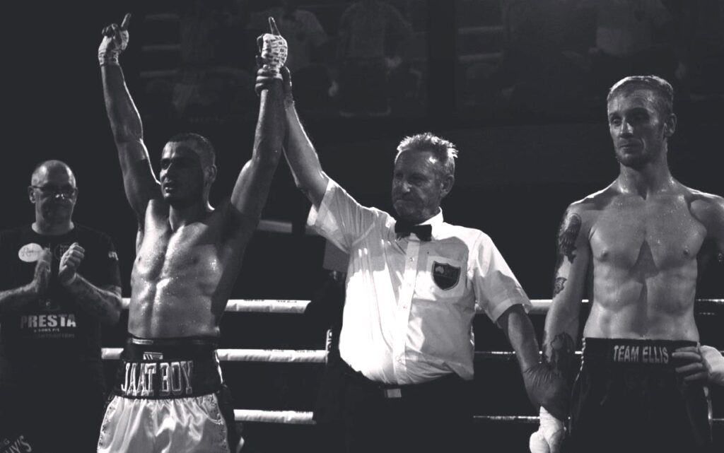 Ref raising the the winner's arm