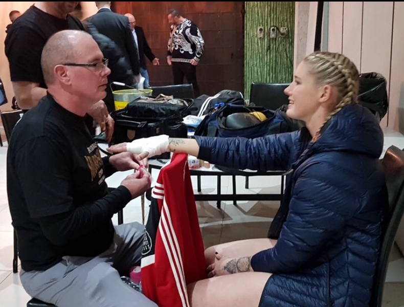 Gerry wrapping Tayla's hands