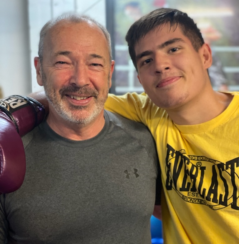 Two boxers hugging it out