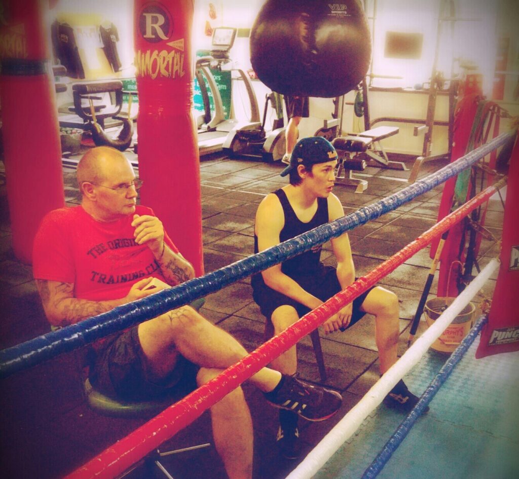 Gerry sitting behind the ring